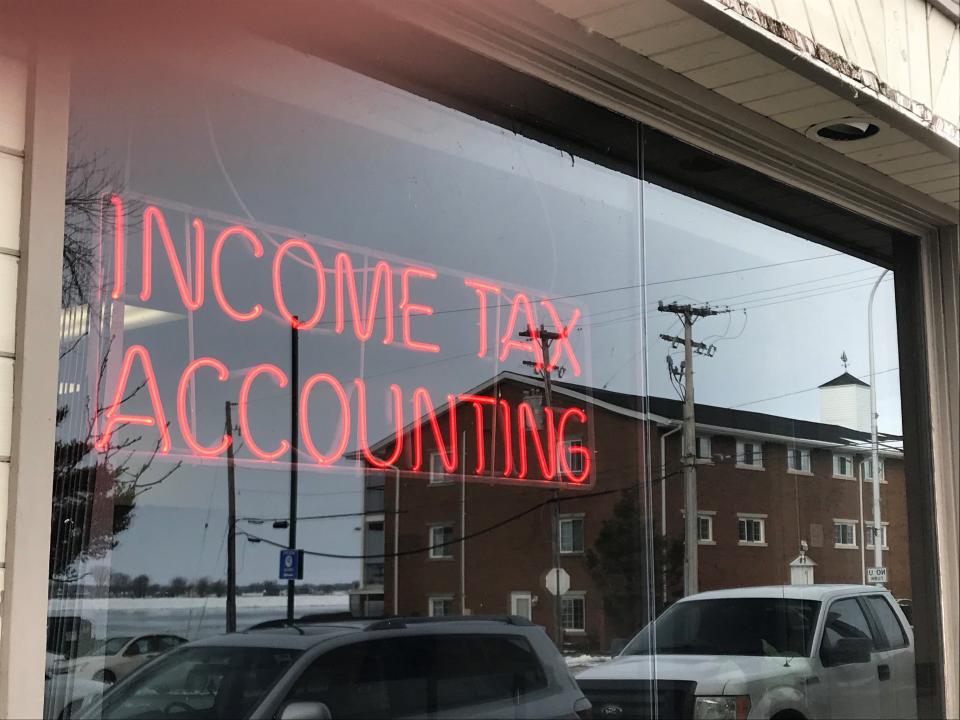 Some people are filing taxes early in 2021 in order to claim as much stimulus cash upfront, if a third stimulus payment is issued. Tax business window in Marine City, Michigan.