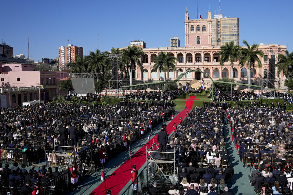 People attend the swearing-in ceremony of President Santiago Pena at Palacio de Lopez, the presidential palace, on his inauguration day in Asuncion, Paraguay, Tuesday, Aug. 15, 2023. (AP Photo/Jorge Saenz)