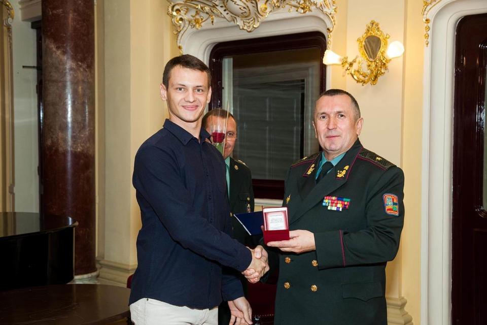 Rostyslav Yanchyshen (L) was awarded the Southern Operational Command honors in 2016. Yanchyshen was a member of the Right Sector — a Ukrainian nationalist movement — and participated in demonstrations in Odesa during the EuroMaidan Revolution in 2014. (Dmytro Yanchyshen)