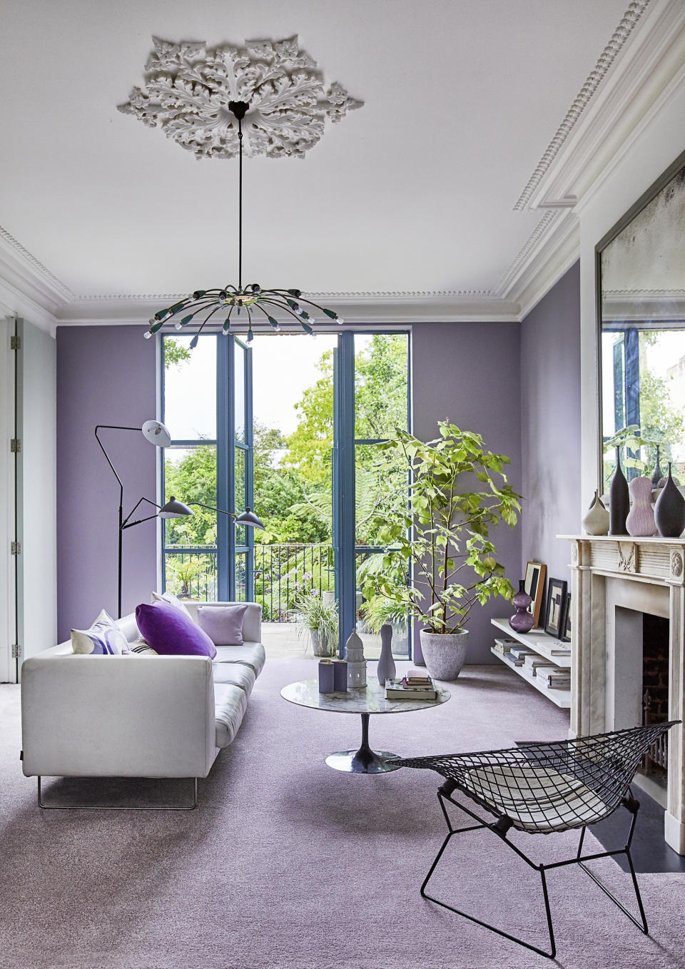 <p> Lilac is big news in the interior design sphere at the moment and we're expecting to see a surge in this pretty pastel shade throughout the year. With cool bluey undertones, lilac is an inherently cool color. This means it works particularly well in south-facing rooms, so the cool tones can balance out the yellow warmth of the sun to create an ambiance that's pleasing to the eye. We love the color courage in this space of taking the shade on all walls and floors. Sticking to black and white with the furniture and accessories makes for a calm and cohesive scheme, letting the lilac do the talking. This living room idea is one we'll be copying this season, and we've got our eye on French Lilac from Benjamin Moore to recreate the look. </p>