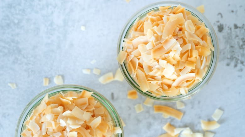 two bowls of toasted coconut flakes