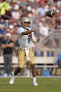 UCLA quarterback Dorian Thompson-Robinson (1) throws a pass against the Stanford during the first half of an NCAA college football game Saturday, Sept. 25, 2021, in Stanford, Calif. (AP Photo/Tony Avelar)