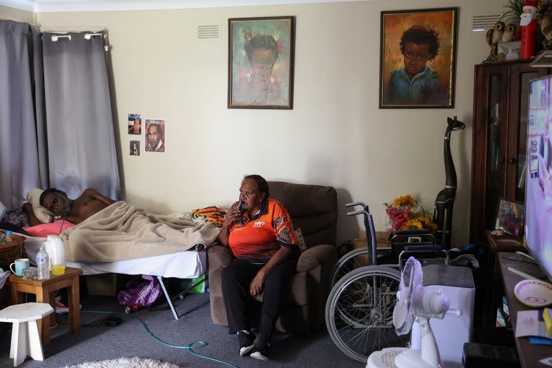 Indigenous Muruwari elder Rita Wright is seen at home with her son in Sydney