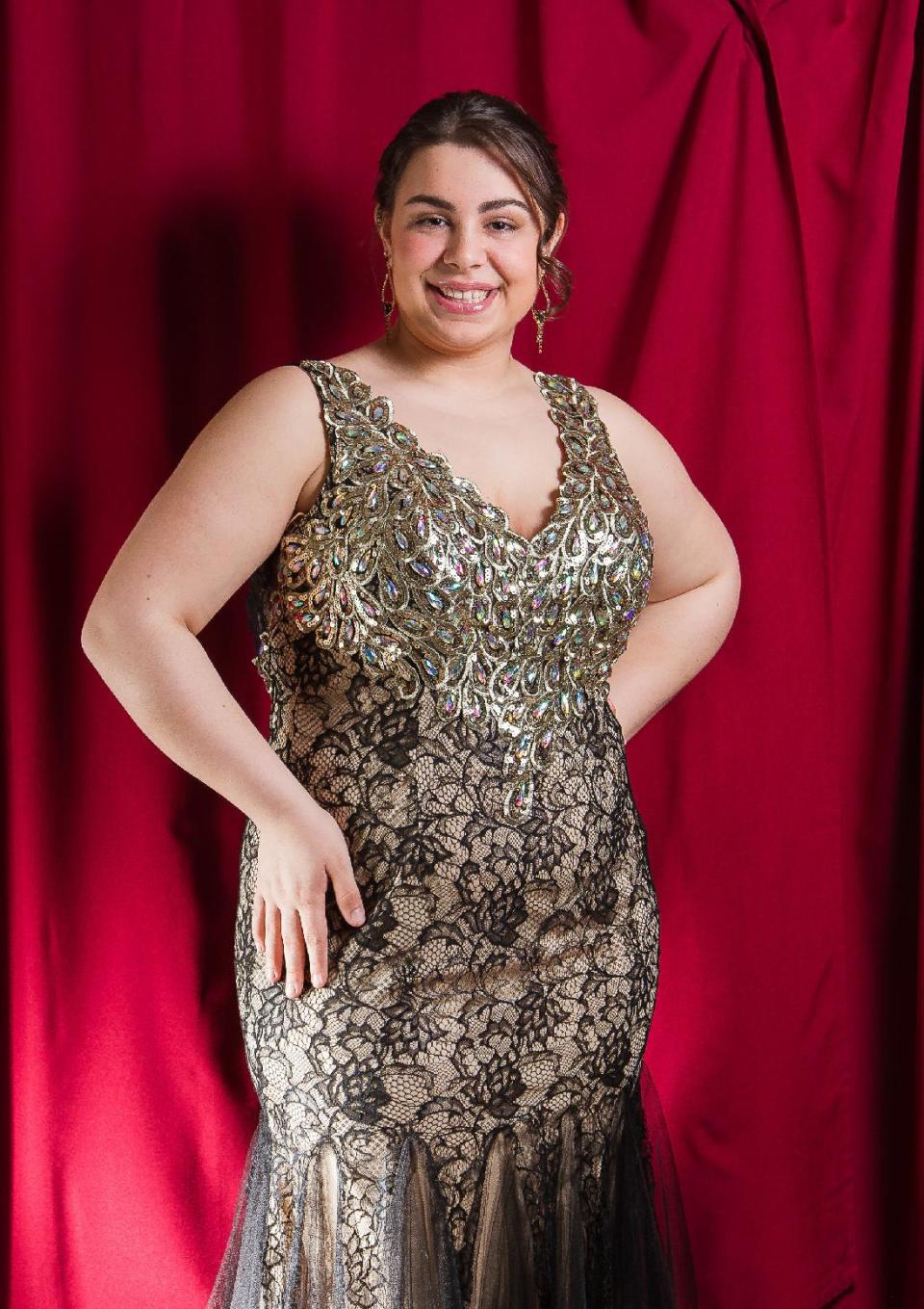 This undated image released by New York City Glitz shows Maria Giorno, 18, a high school senior from Manchester Township, N.J., models a prom dress at New York City Glitz boutique in Pine Beach, N.J. (AP Photo/New York City Glitz, Philip Shepherd)