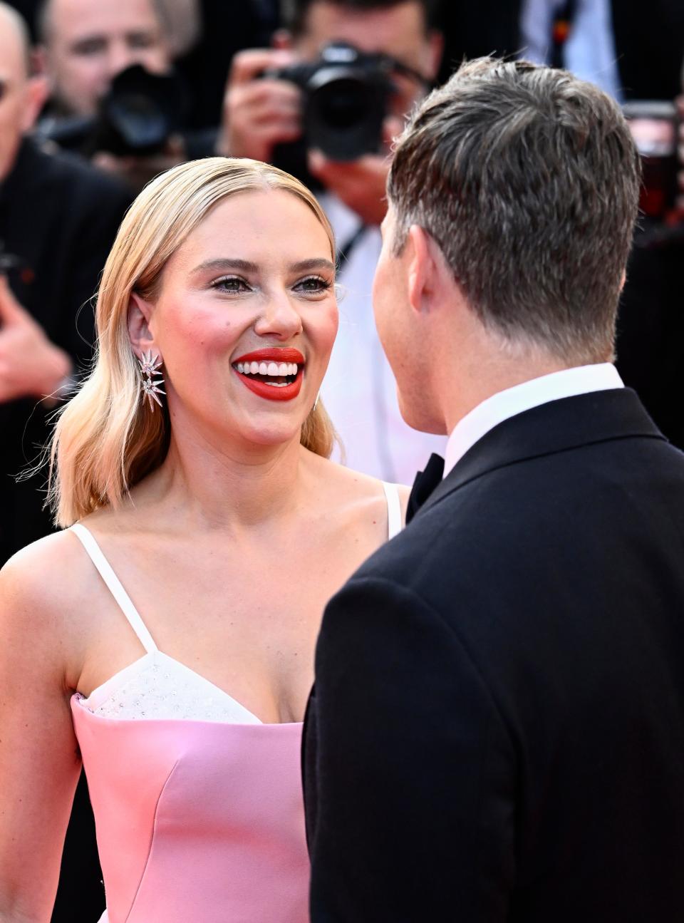 Colin Jost and Scarlett Johansson attend the "Asteroid City" red carpet during the 76th annual Cannes film festival at Palais des Festivals on May 23, 2023 in Cannes, France.