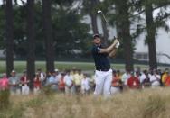 Justin Rose of England watches his shot from the rough on the 12th hole during the first round of the U.S. Open Championship golf tournament in Pinehurst, North Carolina, June 12, 2014. REUTERS/Mike Segar