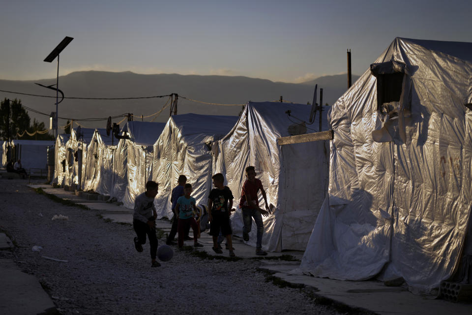 Syrian children play soccer by their tents at a refugee camp in the town of Bar Elias in the Bekaa Valley, Lebanon, July 7, 2022. The Lebanese government’s plan to start deporting Syrian refugees has sent waves of fear through vulnerable refugee communities already struggling to survive in their host country. Many refugees say being forced to return to the war shattered country would be a death sentence. (AP Photo/Bilal Hussein)