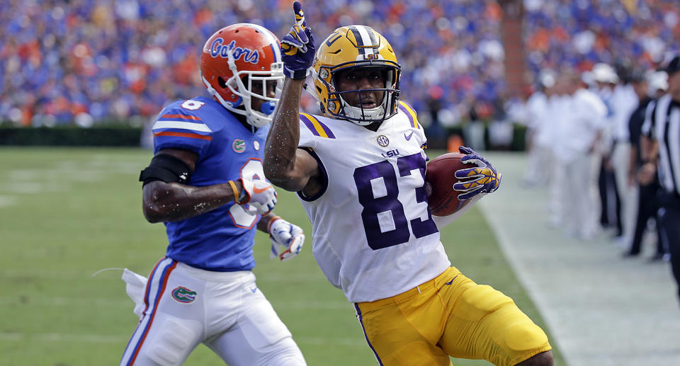 LSU wide receiver Russell Gage crosses the goal line in front of Florida defensive back Nick Washington. (AP)
