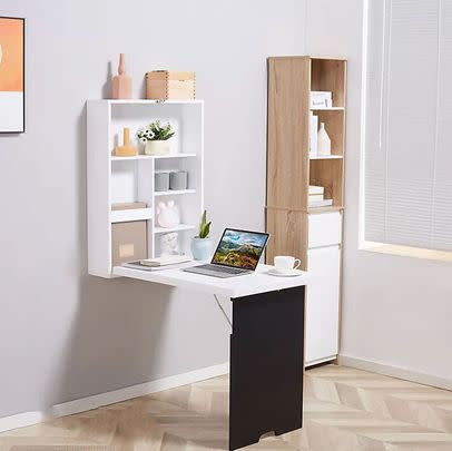 This wall-mounted cabinet doubles as a drop-leaf desk