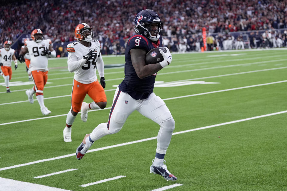 Houston Texans tight end Brevin Jordan runs for a touchdown against the Cleveland Browns during the first half of an NFL wild-card playoff football game Saturday, Jan. 13, 2024, in Houston. (AP Photo/David J. Phillip)