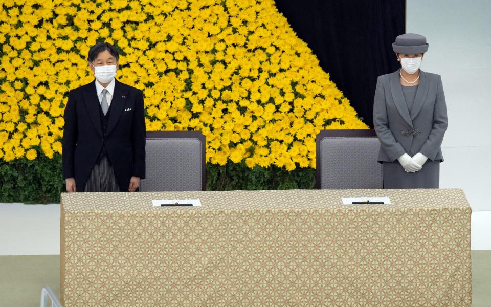 Emperor Naruhito and Empress Masako attend the memorial service marking the 75th anniversary of Japan's surrender at the Nippon Budokan hall in Tokyo -  REUTERS