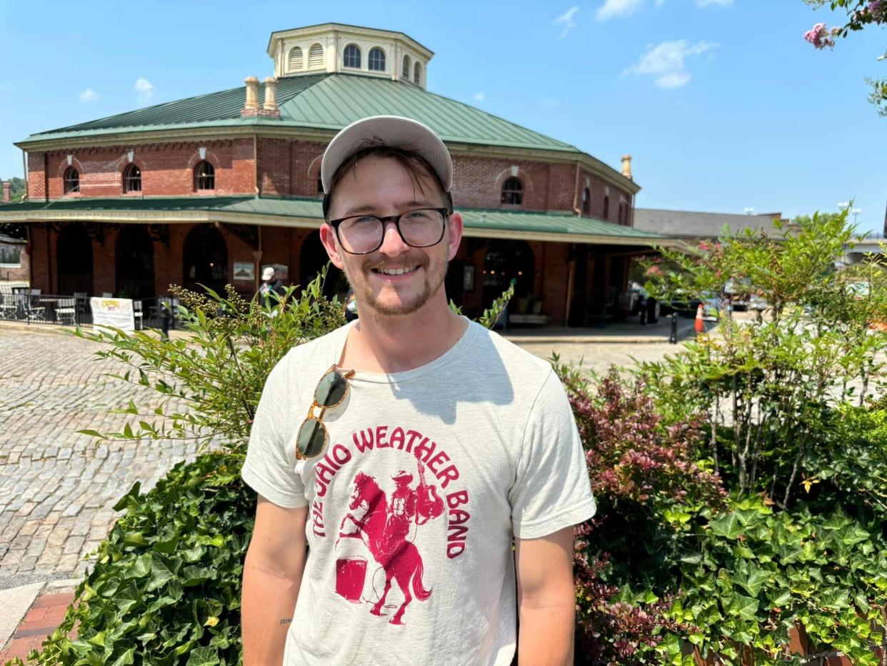 Max Butler of Nashville, Tennessee strikes a pose in historic Old Towne Petersburg on July 16, 2024 during a heat wave.