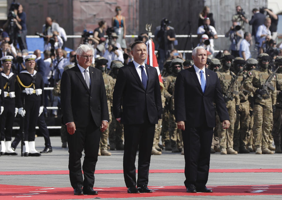 U.S. Vice President Mike Pence, right, Polish President Andrzej Duda, center and German President Frank-Walter Steinmeier stand during a memorial ceremony marking the 80th anniversary of the start of World War II in Warsaw, Poland, Sunday, Sept. 1, 2019. (AP Photo/Petr David Josek)