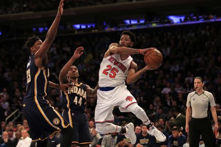 Dec 20, 2016; New York, NY, USA; New York Knicks guard Derrick Rose (25) looks to pass around Indiana Pacers center Myles Turner (33) during the second half at Madison Square Garden. Mandatory Credit: Adam Hunger-USA TODAY Sports