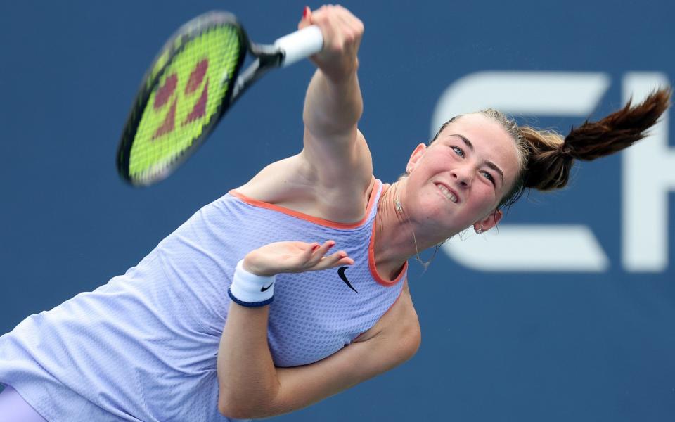 Mika Stojsavljevic serves against Charo Esquiva Banuls of Spain during their Junior Girls' US Open first round match, September 1, 2024