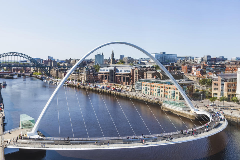 England, Tyne and Wear, Gateshead, Newcastle, Gateshead Millenium Bridge and Newcastle Skyline. (Photo by: Prisma Bildagentur/UIG via Getty Images)