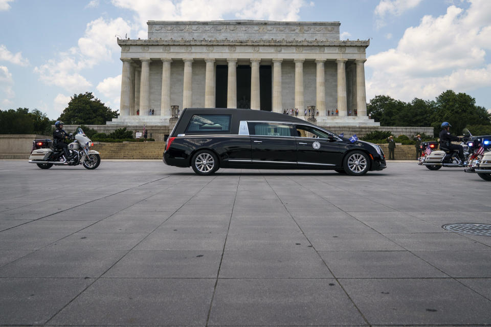 WASHINGTON, DC - JULY 27: A hearse carrying the flag-draped casket with the body of Rep. John Lewis (D-GA) stops in front of the Lincoln Memorial before heading to the U.S. Capitol where he will lie in state July 27, 2020 in Washington, DC.  / Credit: Drew Angerer / Getty Images