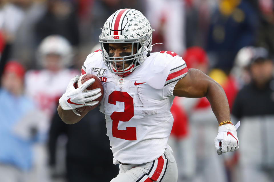 Ohio State running back J.K. Dobbins runs for a 33-yard touchdown against Michigan in the second half of an NCAA college football game in Ann Arbor, Mich., Saturday, Nov. 30, 2019. (AP Photo/Paul Sancya)