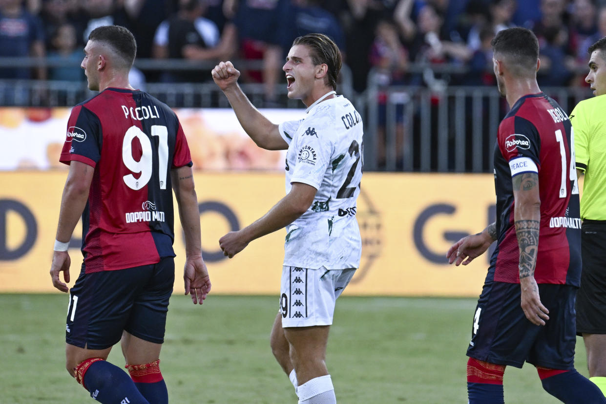 Empoli's Lorenzo Colombo, center, celebrates after scoring his side's opening goal during the Italian Serie A soccer match between Cagliari and Empoli at the Unipol Domus in Cagliari, Italy, Friday, Friday, Sept. 20, 2024. (Gianluca Zuddas/LaPresse via AP)