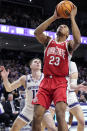 Ohio State forward Zed Key, right, looks at the basket past Northwestern guard Brooks Barnhizer, left, during the first half of an NCAA college basketball game in Evanston, Ill., Saturday, Jan. 27, 2024. (AP Photo/Nam Y. Huh)