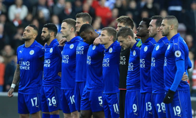 Leicester City players pause for a minute of silence on December 3, 2016, in honour of the victims of a plane crash that decimated the Brazilian team Chapecoense Real when it crashed in Colombia