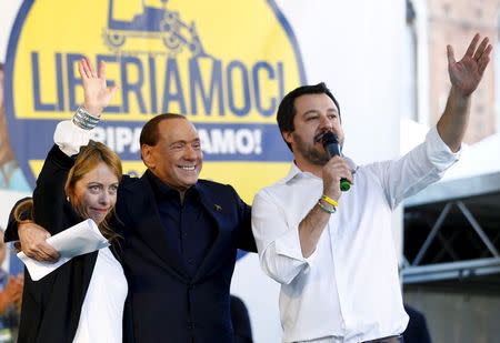 Forza Italia party (PDL) leader Silvio Berlusconi (C) stands with Northern League leader Matteo Salvini (R) and Fratelli D'Italia leader Giorgia Meloni during a Northern League rally in Bologna, central Italy, November 8, 2015 REUTERS/Stefano Rellandini