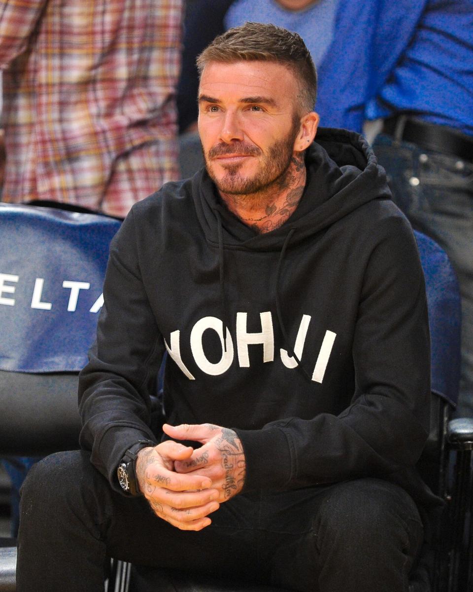 David Beckham roots for the team that always wins: Yohji Yamamoto's.