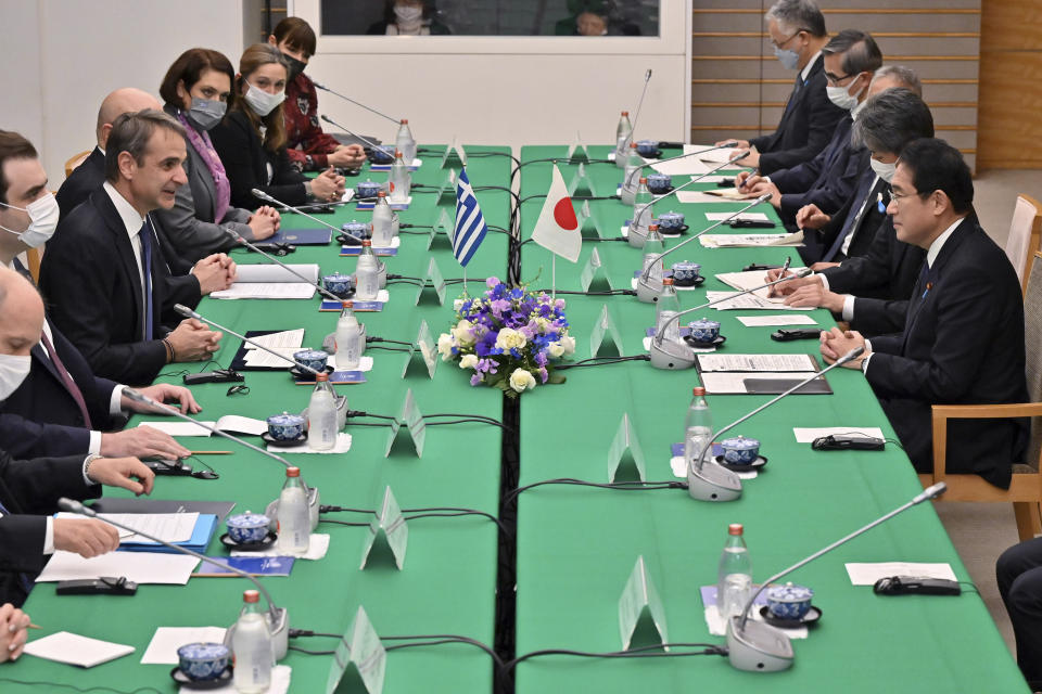 Greek Prime Minister Kyriakos Mitsotakis, third left, speaks to Japanese Prime Minister Fumio Kishida during their meeting at the prime minister's official residence in Tokyo on Monday, Jan. 30, 2023. (Richard A. Brooks/Pool Photo via AP)