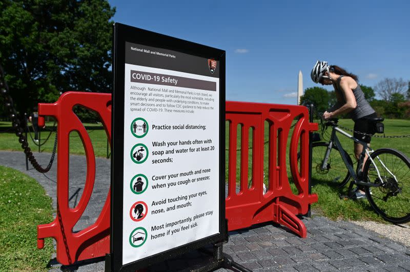 A COVID-19 safety sign is posted near the Vietnam Memorial in Washington