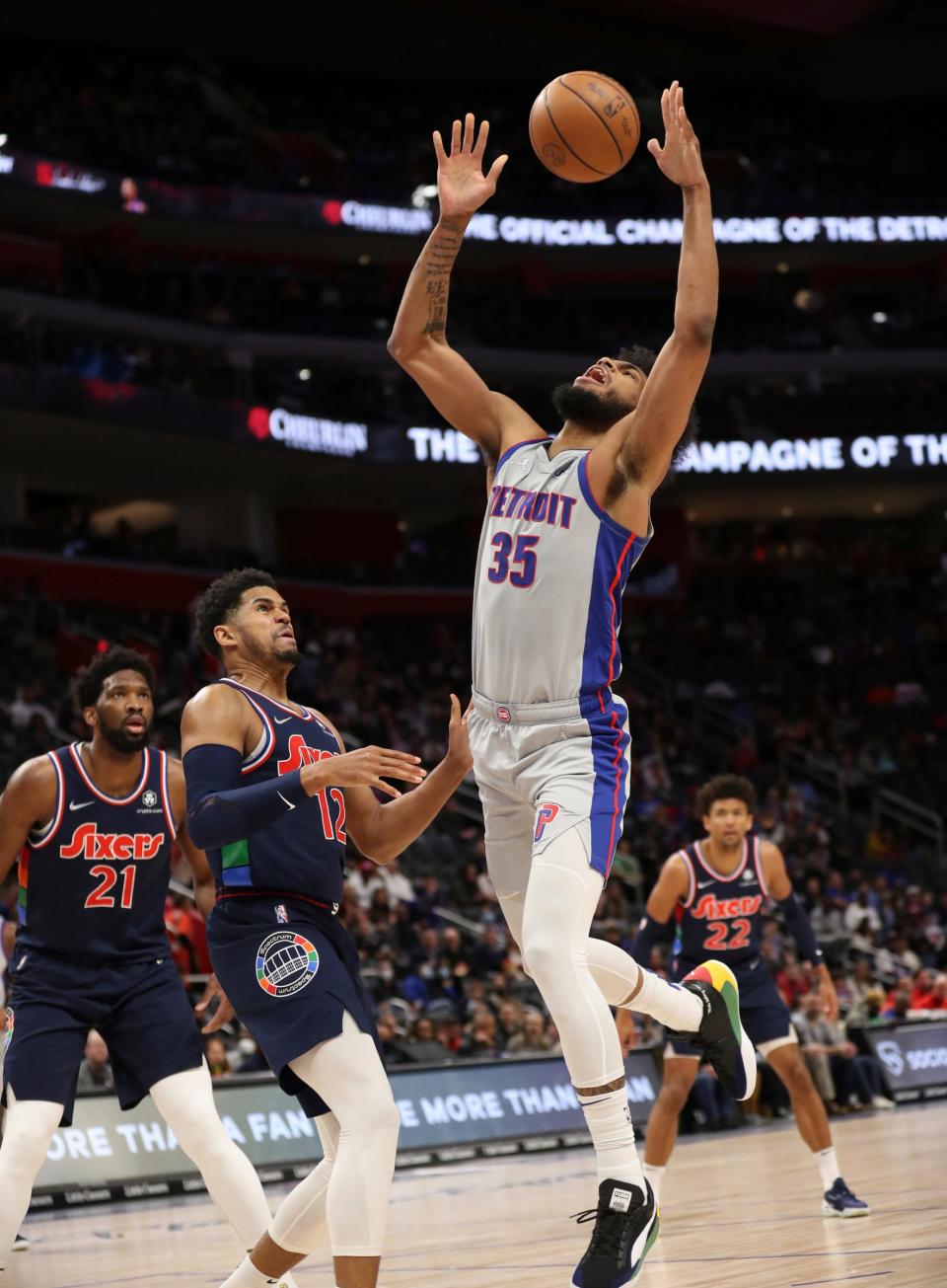 Detroit Pistons forward Marvin Bagley III (35) is fouled by Philadelphia 76ers forward Tobias Harris (12) during first quarter action on Thursday, March 31, 2022, at Little Caesars Arena in Detroit.