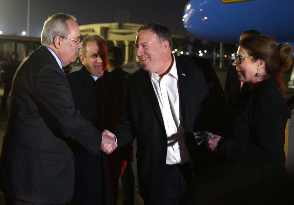 U.S. Secretary of State Mike Pompeo, and his wife Susan, right, are greeted by Assistant Foreign Minister For North and South American Affairs, Reda Habeeb Ibrahim Zaki , second from left, and Charge d'Affaires for the US Embassy in Egypt, Tom Goldberger at they arrive at Cairo International Airport in Cairo, Wednesday, Jan. 9, 2019. (Andrew Caballero-Reynolds/Pool Photo via AP)