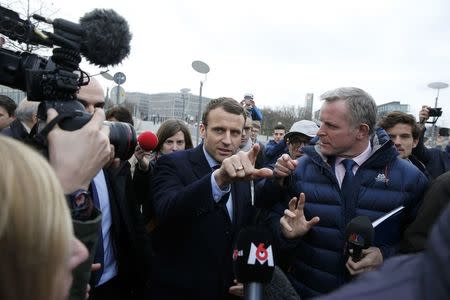 Emmanuel Macron, head of the political movement En Marche ! (or Onwards !) and candidate for the 2017 presidential election leaves the Chancellery after a meeting with German Chancellor Angela Merkel in Berlin, Germany, March 16, 2017. REUTERS/Fabrizio Bensch