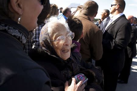 Founding member of the Fairbanks Native Association Poldine Carlo (C) sings a song about Denali after meeting U.S. President Barack Obama after he arrived aboard Air Force One at Elmendorf Air Force Base in Anchorage, Alaska August 31, 2015. REUTERS/Jonathan Ernst