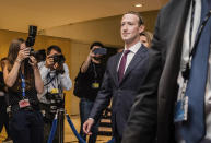 FILE - In this file photo dated Tuesday, May 22, 2018, Facebook CEO Mark Zuckerberg leaves the EU Parliament in Brussels during a series of meetings over data protection standards at the internet giant and alleged misuse of the personal information. The European Federal Cartel Office issued a ruling in February 2019 making it harder for Facebook to combine data from all its services to target ads more precisely to users. (AP Photo/Geert Vanden Wijngaert, FILE)