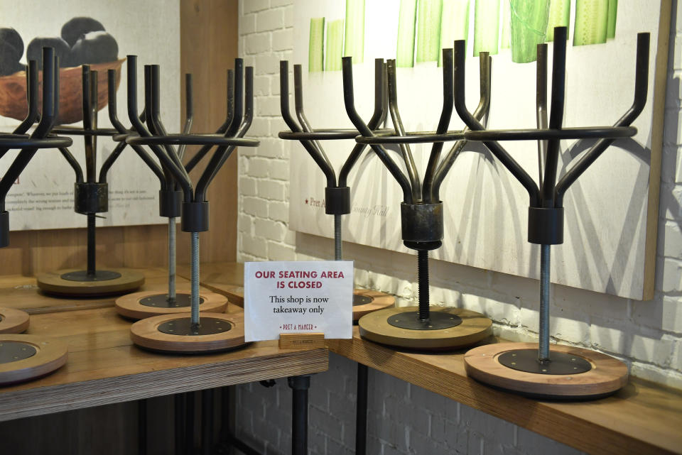 A closed off seating area in a branch of Pret a Manger in Westminster, London, as the death toll from coronavirus in the UK reached 71 people.