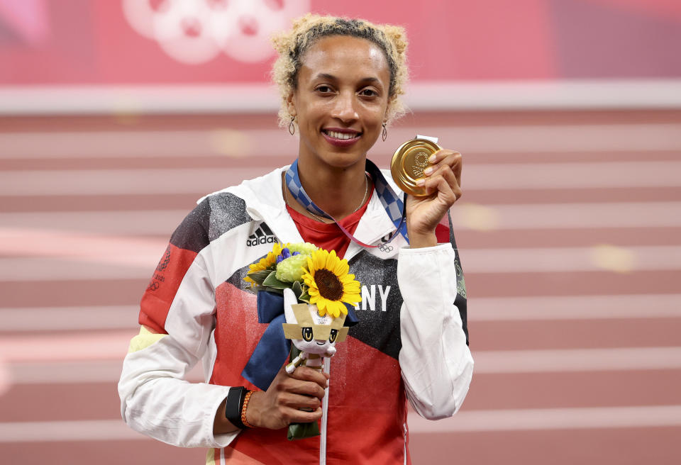 Malaika Mihamboon of Germany poses with her gold medal