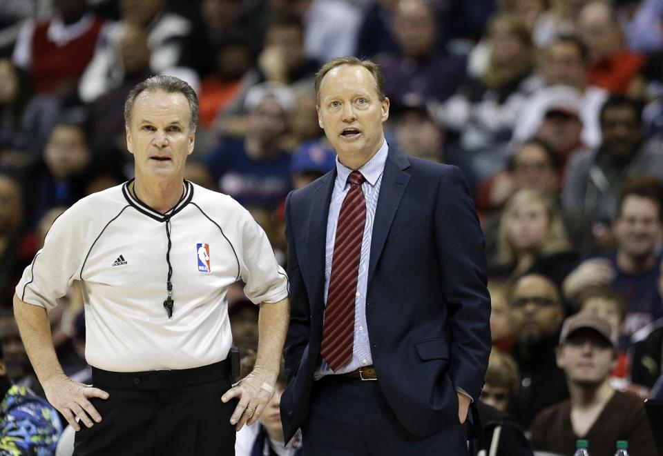 Atlanta Hawks' head coach Mike Budenholzer, right, talks with referee Mike Callahan during the fourth quarter of an NBA basketball game against the Oklahoma City Thunder, Friday, Jan. 23, 2015, in Atlanta. (AP Photo/David Goldman)