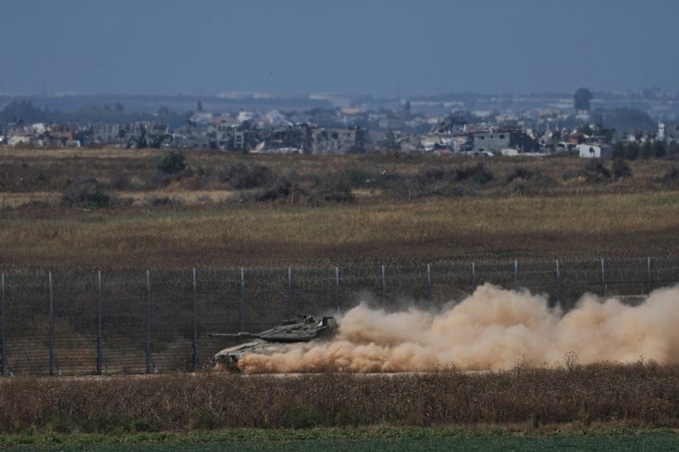 An Israeli tank moves near the Israeli-Gaza border, as seen from southern Israel (Copyright 2024 The Associated Press. All rights reserved.)