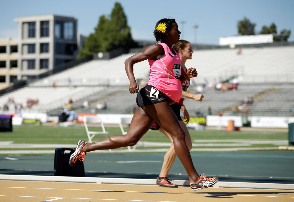 SACRAMENTO, CA - JUNE 26: A pregnant Alysia Montano runs in the opening round of the women's 800 meter run during day 2 of the USATF Outdoor Championships at Hornet Stadium on June 26, 2014 in Sacramento, California. (Photo by Ezra Shaw/Getty Images)