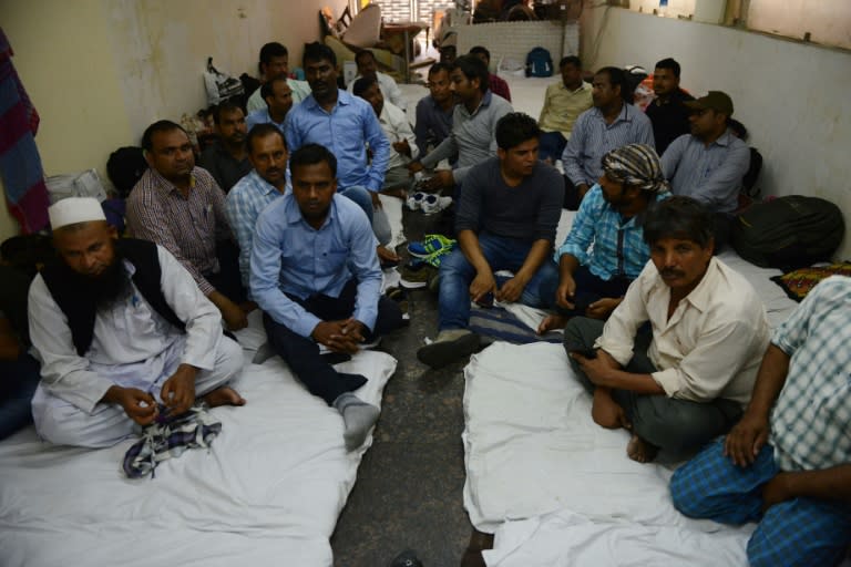 Indian workers from Bihar state gather in a New Delhi hotel after the Indian government repatriated them from Saudi Arabia