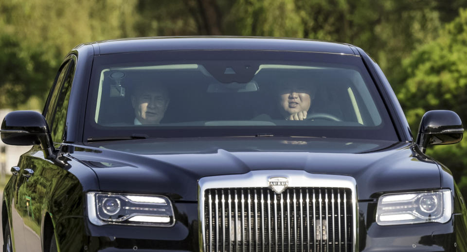 North Korea's leader Kim Jong Un, right, drives a Russian Aurus limousine as Russian President Vladimir Putin sits on the left during their meeting in Pyongyang, North Korea, on Wednesday, June 19, 2024. (Gavriil Grigorov, Sputnik, Kremlin Photo via AP)