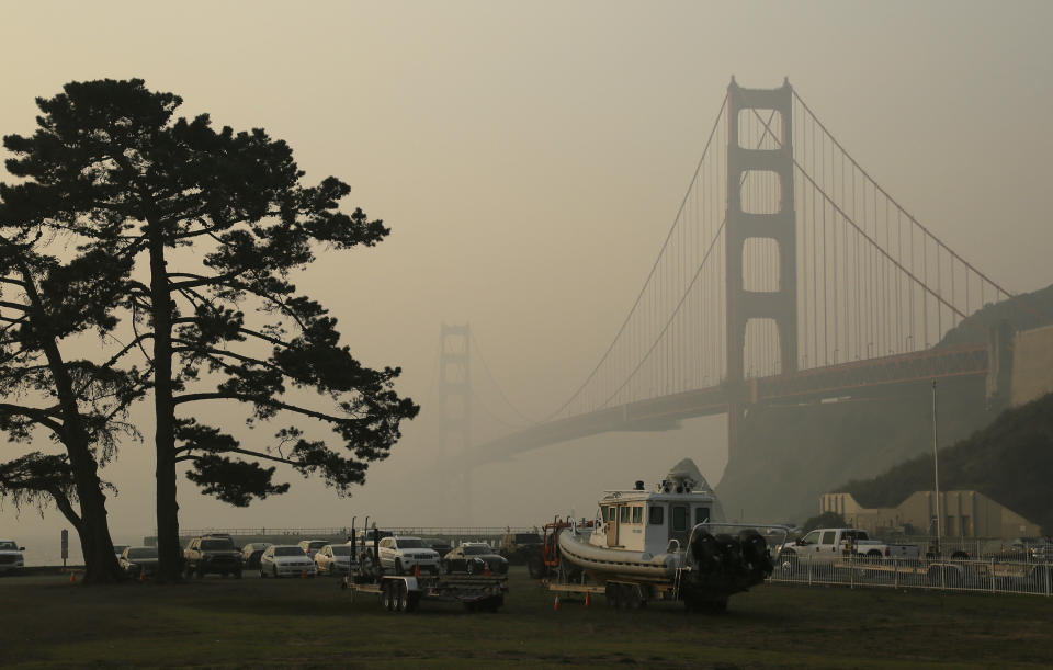 The Golden Gate Bridge is obscured by smoke and haze from wildfires Friday. (Photo: Eric Risberg/ASSOCIATED PRESS)
