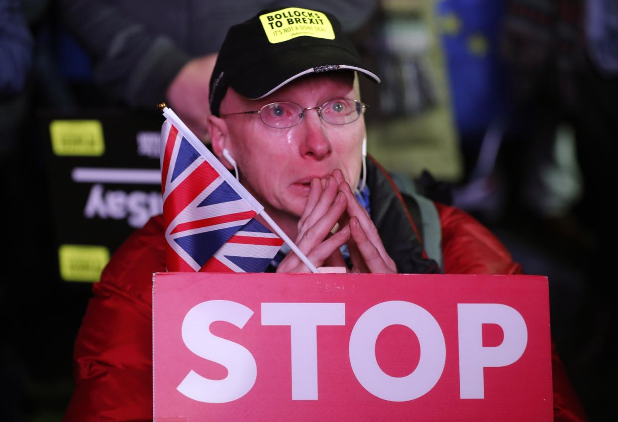 An anti-Brexit protester weeps, but feelings are strong on both sides (AP Photo/Frank Augstein)