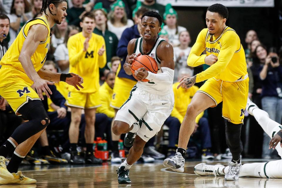 Michigan State guard Tyson Walker (2) steals the ball from Michigan guard Jaelin Llewellyn (3) during the second half of MSU's 81-62 win over Michigan on Tuesday, Jan. 30, 2024, in East Lansing.