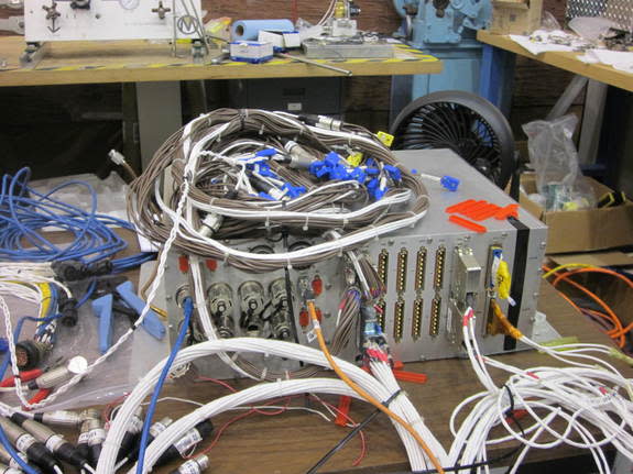 An avionics unit and cables being readied for a second Morpheus prototype moon lander to replace the first vehicle, which crashed during an August 2012 test flight.