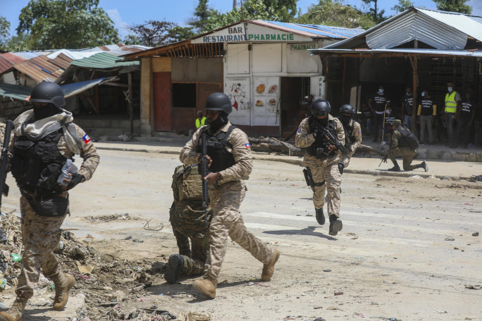 Haitian police patrol near the General Hospital after Haitian Prime Minister Garry Conille visited the facility in Port-au-Prince, Haiti, Tuesday, July 9, 2024. Haiti's prime minister and police chief visited the capital's largest hospital after authorities announced that police took control of the medical institution over the weekend from armed gangs. (AP Photo/Odelyn Joseph)