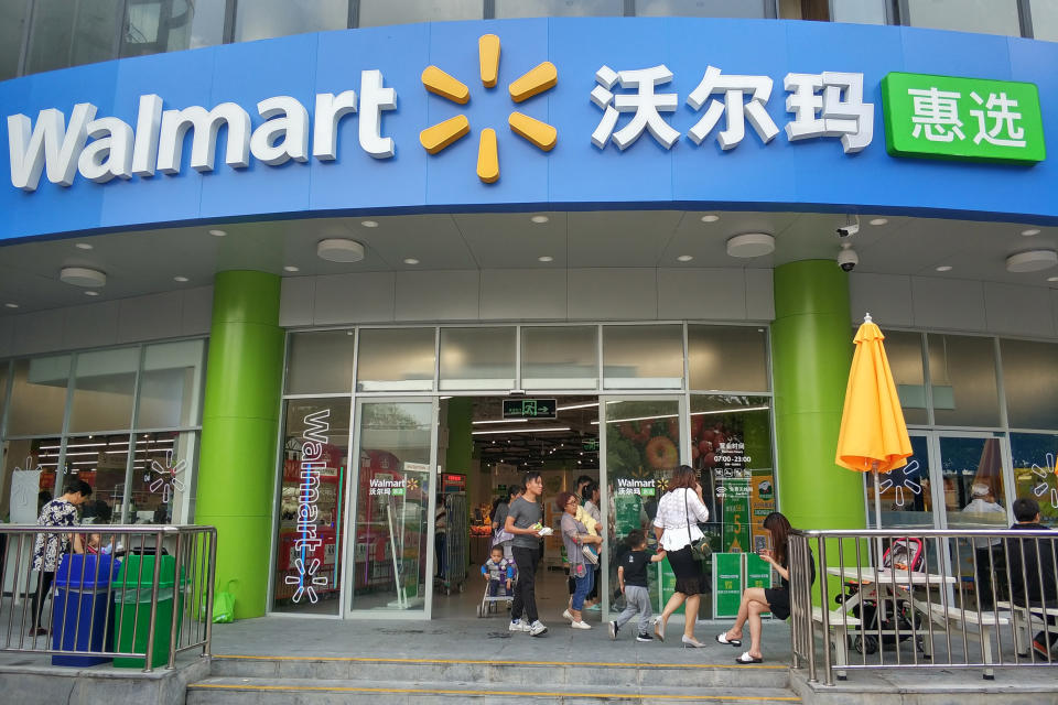 Customers are seen at Walmart Inc.'s first supermarket in China where smartphones can be used to pay for items that are mostly available in its store on a JD.com online platform, in Shenzhen, Guangdong province, China April 4, 2018. REUTERS/Stringer  ATTENTION EDITORS - THIS IMAGE WAS PROVIDED BY A THIRD PARTY. CHINA OUT.