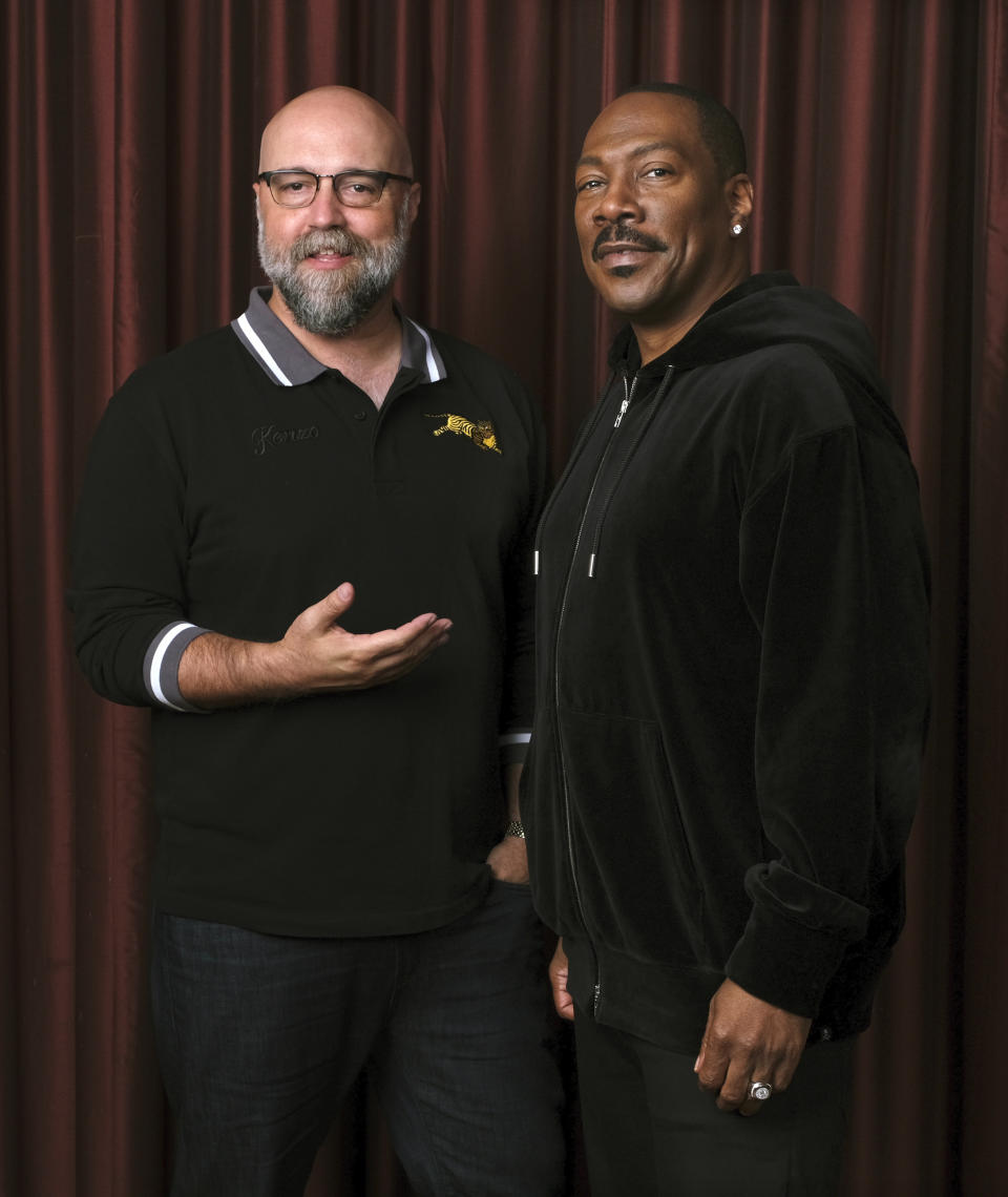 FILE - This Sept. 7, 2019 file photo shows Eddie Murphy, right, star of the film "Dolemite Is My Name," with director Craig Brewer at the Shangri-La Hotel during the Toronto International Film Festival in Toronto. (Photo by Chris Pizzello/Invision/AP, File)