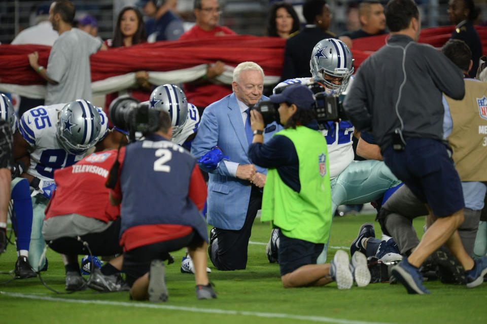 Sep 25, 2017; Glendale, AZ, USA; Dallas Cowboys owner Jerry Jones kneels with players prior to the national anthem prior to the game against the Arizona Cardinals at University of Phoenix Stadium. Mandatory Credit: Joe Camporeale-USA TODAY Sports