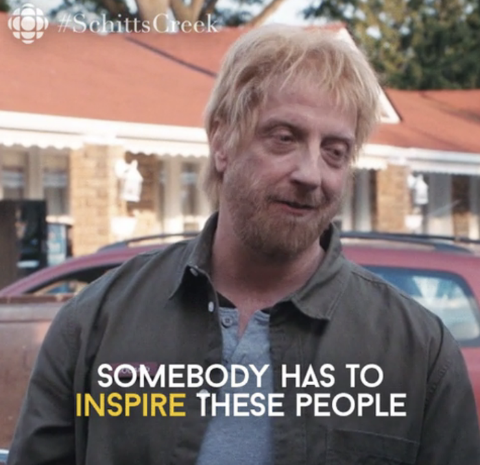 Man with a smile, subtitle: "Somebody has to inspire these people" from TV show Schitt's Creek